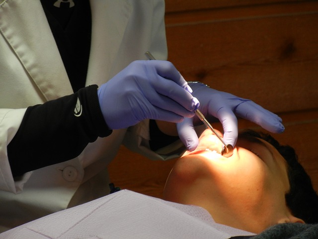 dentist checking a patient's mouth